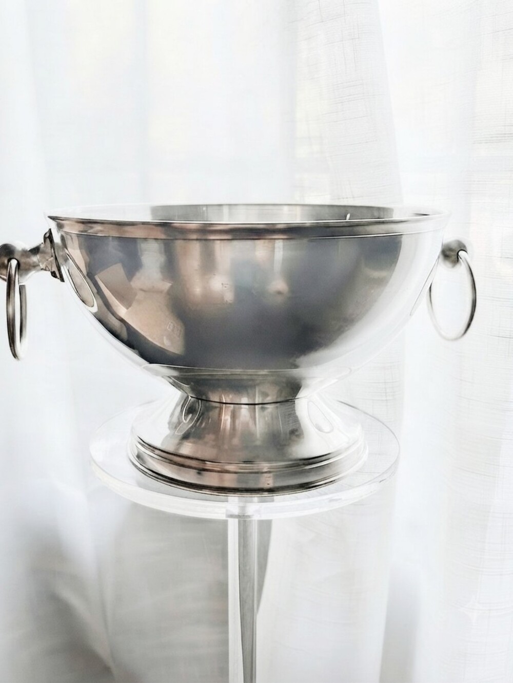 Silver-plated pedestal bowl with ring handles